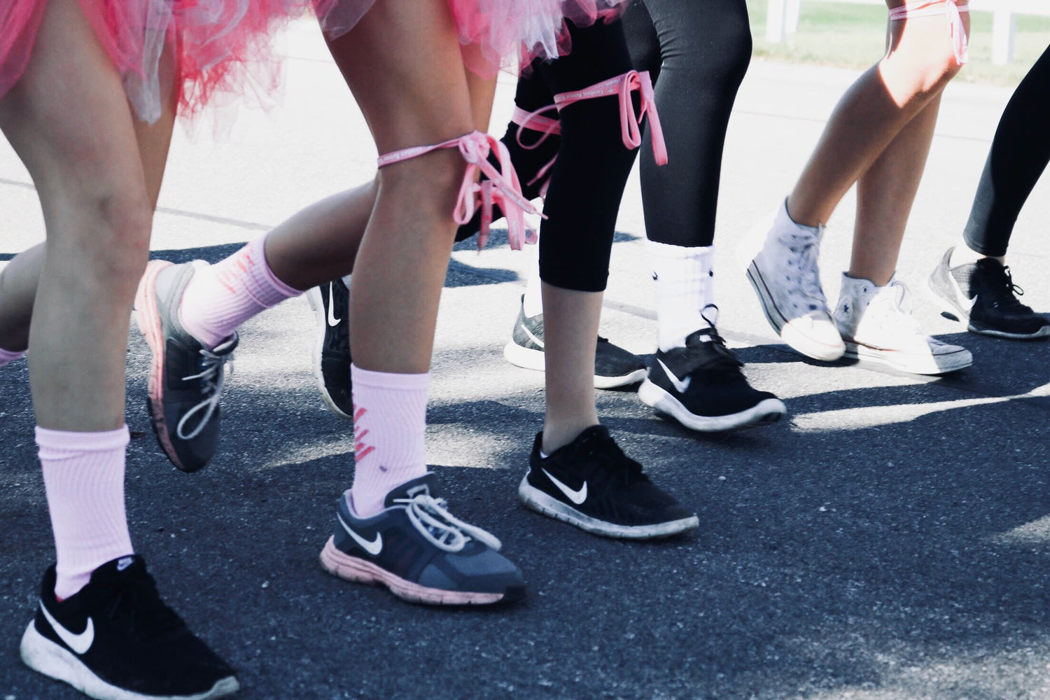 Women walking fundraiser wearing Nike athletic shoes