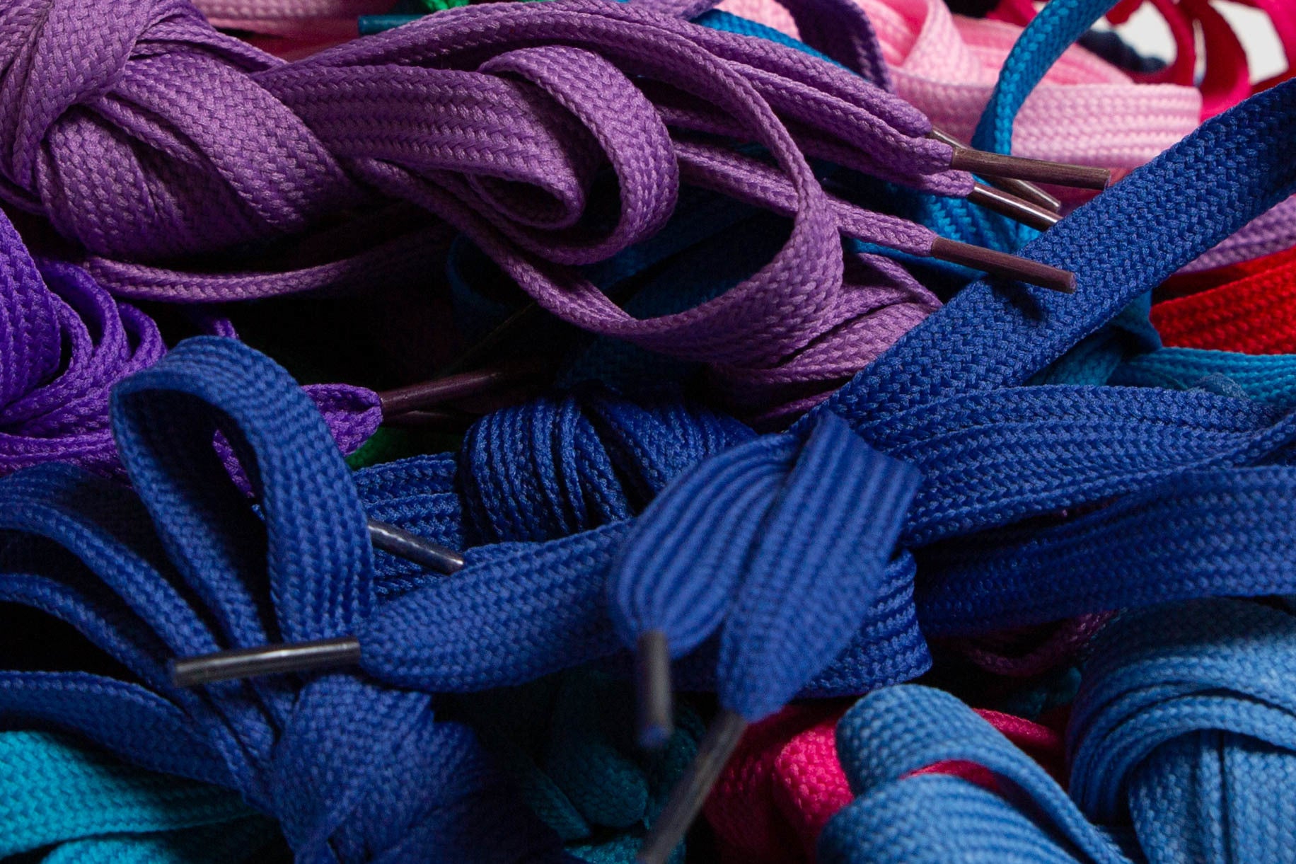 Close up of purple and blue sneaker laces